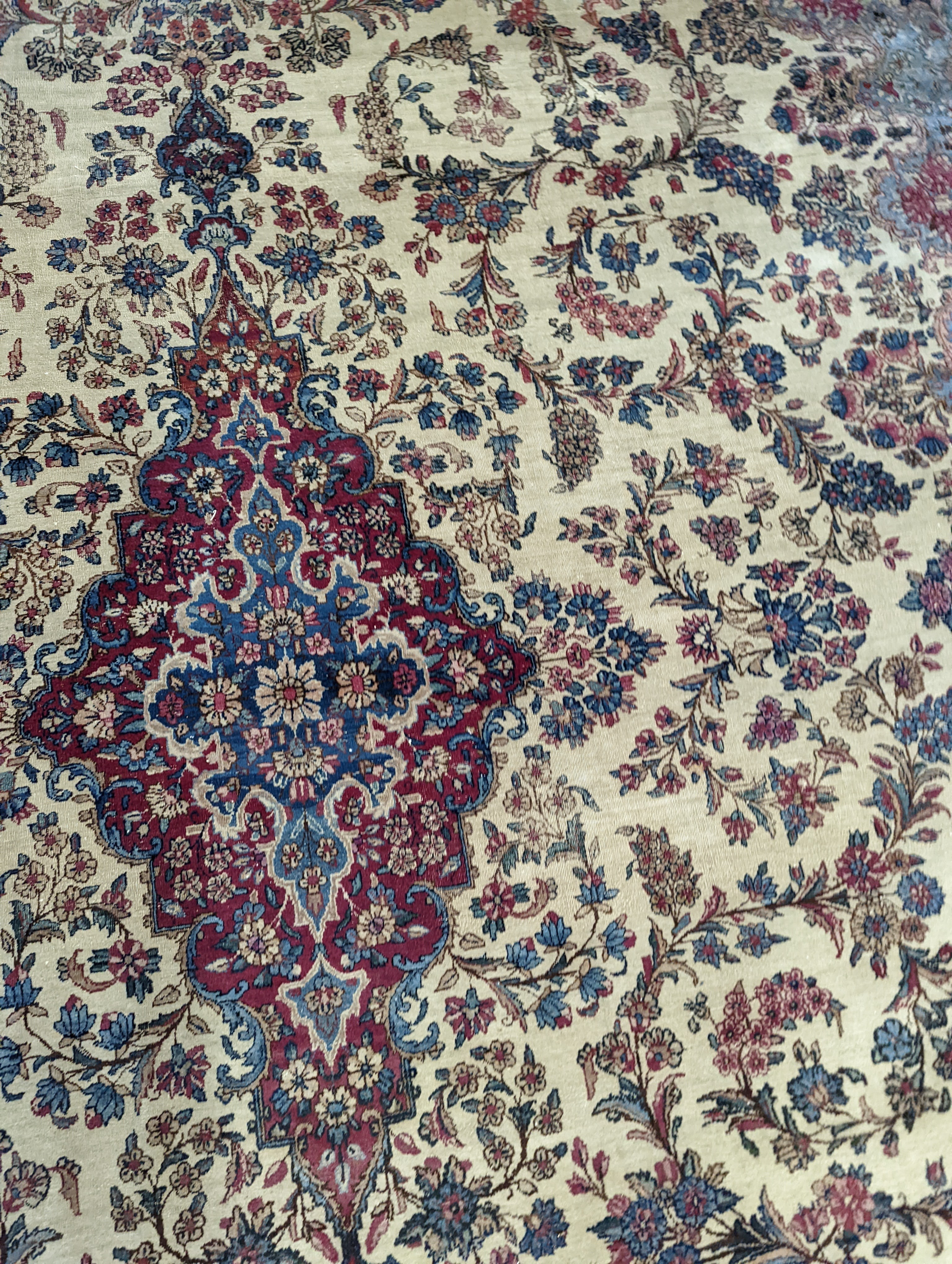 A North West Persian ivory ground carpet, 396 x 290cm